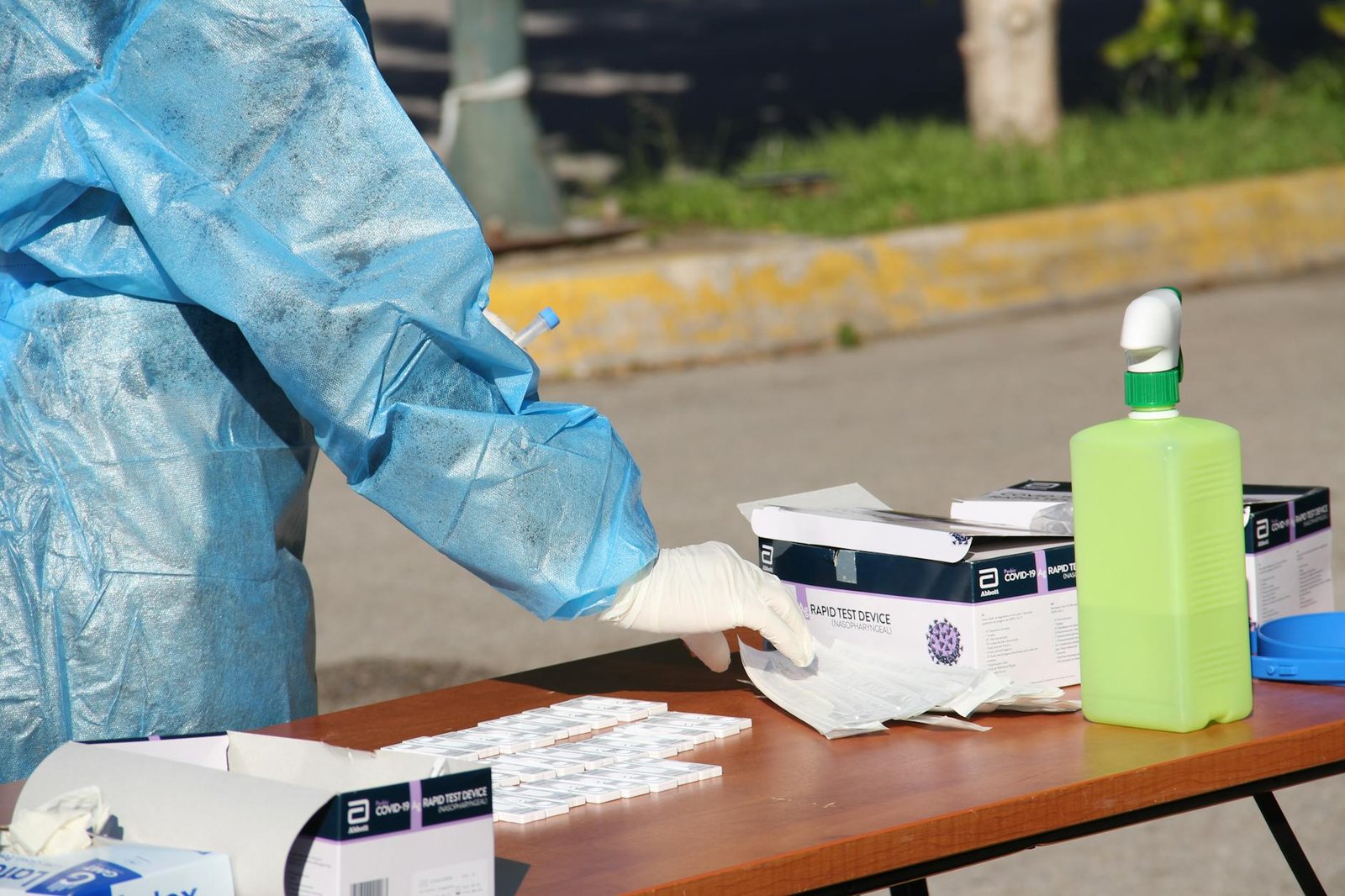 Healthcare worker conducting COVID-19 testing outdoors