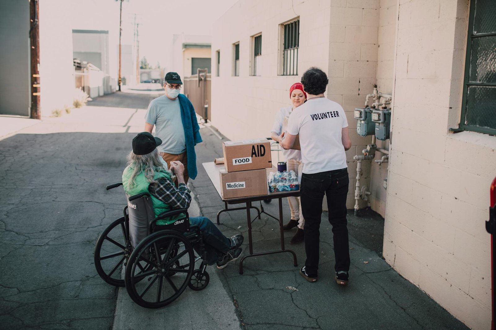 Volunteers distributing aid and medicine to those in need